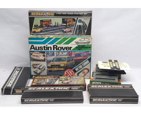 Scalextric Slot Racing group to include (1) C652 Austin Rover set, previously used and includes 2 x slot cars, 2 x hand-held 