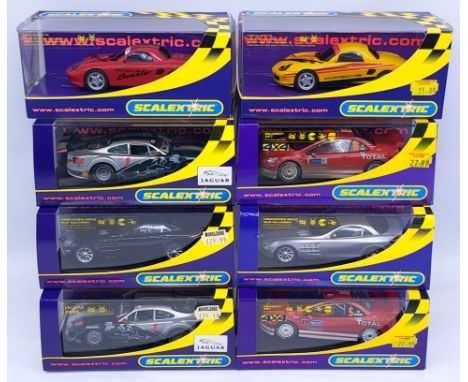 Scalextric, a group of 1:32nd scale Racing Slot Cars to include (1) C2478 Porsche Boxster "Red 04"; (2) C2560 Peugeot 307 WRC