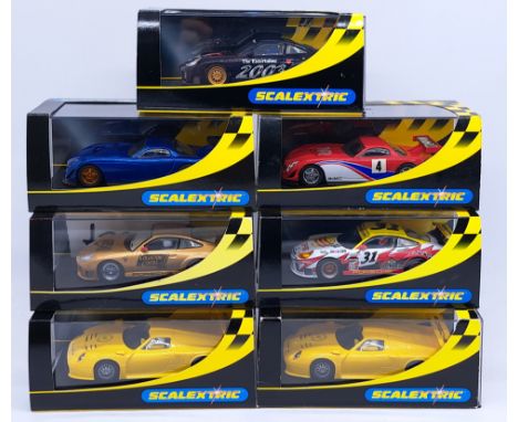 Scalextric, a group of 1:32nd scale Racing Slot Cars to include (1) C2339 Porsche 911 GT3R "White Lightning Motorsport No. 31