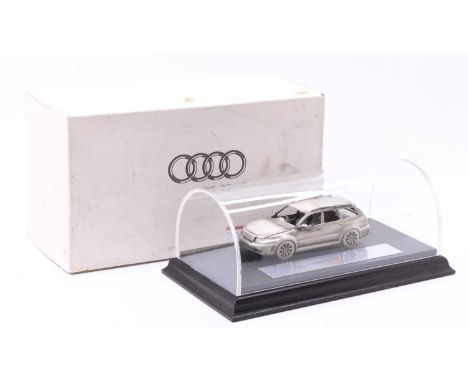 A 1/18 scale limited edition release hand built pewter model of an Audi RS4 Avant Quattro, housed in a perspex display case w