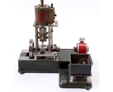 A stationary steam engine comprising of vertical wooden clad cylinder powering a single cylinder engine fitted with slip ecce