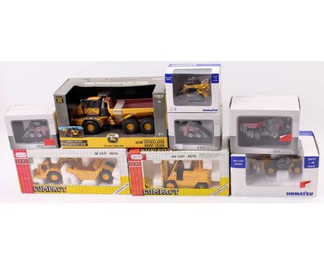 A collection of 8 boxed mixed-scale construction vehicles including a Joal No. 215 Caterpillar Fork Lift Truck, No. 219 Cater