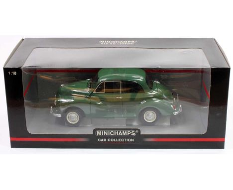 A Minichamps 1/18th scale Morris Minor in green and housed in its original window style box (NMM-BNM)