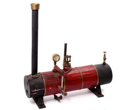 A scratchbuilt stationary steam engine boiler comprising of wooden clad and brassbound body, measures 43cm length x 46cm heig