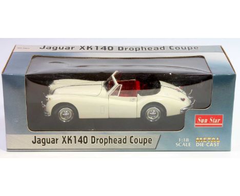 A Sun Star 1/18th scale Jaguar XK140 Drophead Coupe in white and housed in its original window style box (NMM-BNMM)