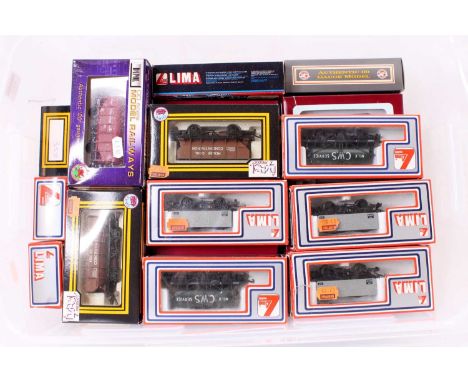 38 various boxed OO gauge items of rolling stock by Dapol and Lima, examples include a Lima C.W.S Milk Service tanker wagon, 