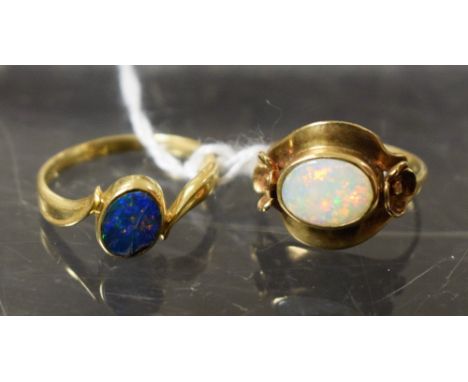 Rings - a 14ct gold black opal twist ring, stamped 585, 2.5g gross;  another, larger, 9ct gold, 3.4g gross (2)