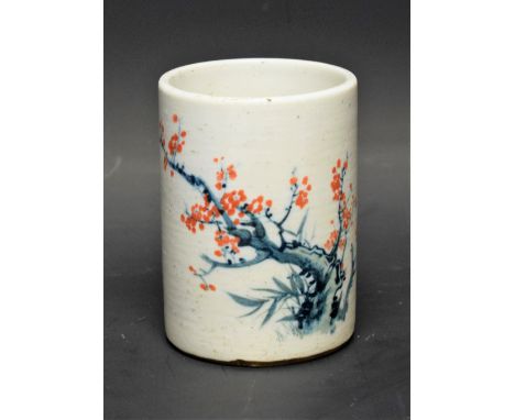 A Chinese ceramic brush pot, prunus decoration, six character mark to base