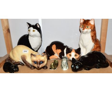 A Siamese ceramic cat figure, by Just Cats &amp; Co; another, similar, black and white; a ginger and white cat; others, simil