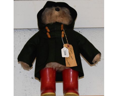 A Paddington Bear, Dunlop Wellington boots, original paper label