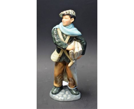 A Royal Doulton ceramic figure, Newsboy, HN2244
