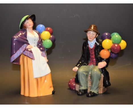 A Royal Doulton ceramic figure, Balloon Lady, HN2935; another, The Balloon Man, HN1954 (2)
