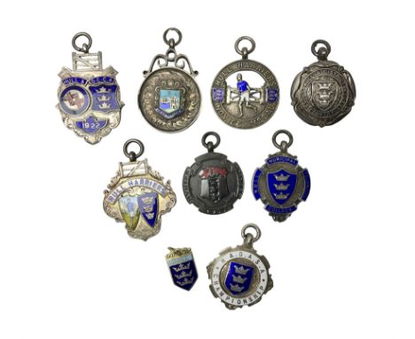 9ct gold enamel 'Hull' charm, together with eight silver fob medallions, six with enamel decoration relating to Hull and one 