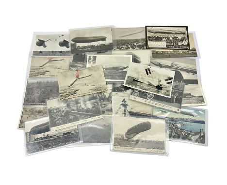 Collection of twenty six postcards depicting Airships/Zeppelins, including two pairs depicting the tragedy of the R.38. wreck