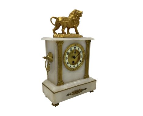 French - mid 19th century 8-day mantle clock in an alabaster case with a flat top surmounted by a gilded roaring lion, with s