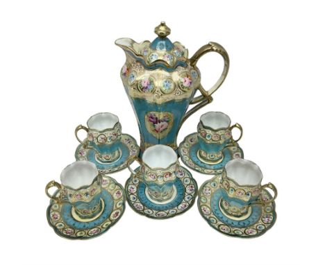 Noritake coffee service, hand painted with roses and gilt detail on a blue ground, comrosing coffee pot, five cups and saucer