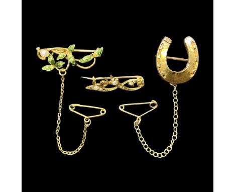 Three gold brooches, including 15ct gold pearl brooch, 9ct gold horseshoe brooch and an enamel leaf broochCondition Report:Ho