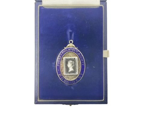 Silver and enamel oval locket pendant, inscribed Pudsey Philatelic Society President, and decorated in enamel with a Penny Bl