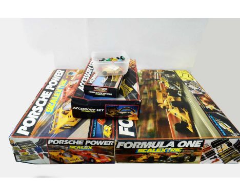 A Scalextric ‘Porsche Power’ model car racing set; Scalextric ‘Formula One’ Silverstone racing set; Scalextric Accessory set;