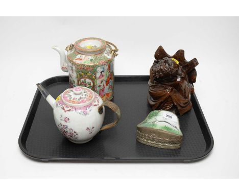 A Chinese famille rose tea pot, decorated with panels of figures and birds over flowering foliage, 20cms high (including hand
