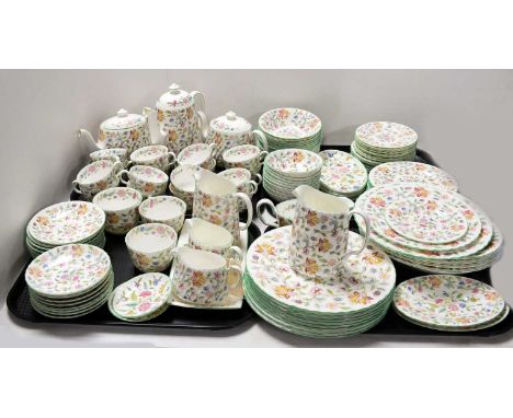 A Minton ‘Haddon Hall’ pattern tea and dinner service, including: two tea pots; coffee pots; two cream jugs; two taller jugs;