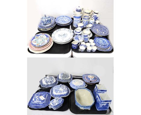 A collection of blue and white ‘Willow’ pattern ceramics, including: circular plates; serving plates; pedestal cake plates; j