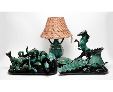 A collection of Blue Mountain pottery animal figures, including: rearing stallion; two dolphins; two swan comports; poodle; e