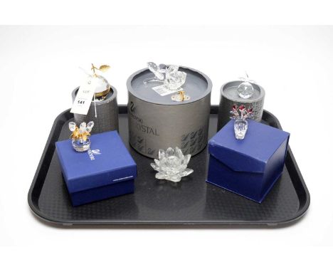 A collection of Swarovski Crystal decorative collectibles, including: Vase with Red Roses; Vase with Tulips; Lotus Flower can