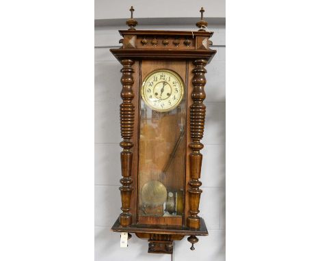 A Vienna style wall clock, late 19th/early 20th Century, the cream enamel arabic dial with two train movement, turned and car