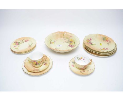 A collection of Royal Worcester floral decorated blush ivory ceramics, including: two cups and saucers; circular bowl; and a 