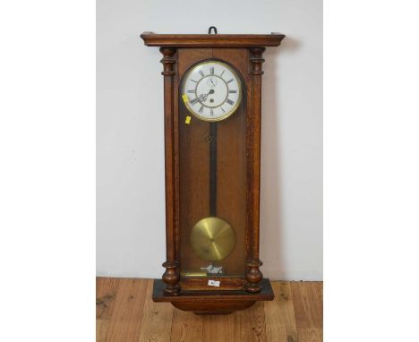 A 20th Century mahogany Vienna style wall clock, the brass and white enamel dial, with Roman chapter ring, set within a glass
