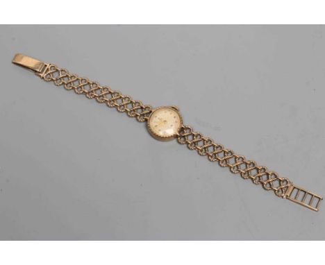 A LADY'S 9CT GOLD TUDOR ROYAL WRISTWATCH, the champagne dial with gilt white Arabic numerals enclosing subsidiary seconds dia