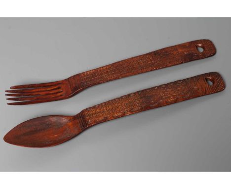A VICTORIAN WELSH TREEN LOVE SPOON AND FORK, 1882, both with a chip carved inscription "Madam Sybil Margaret Thomas/Born Febr