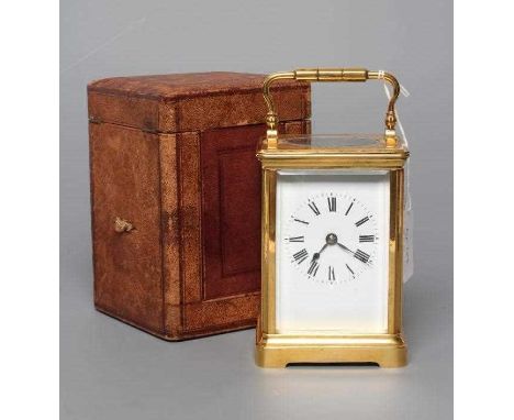 A BRASS CARRIAGE CLOCK, early 20th century, the twin barrel movement with platform escapement striking the hour and half hour