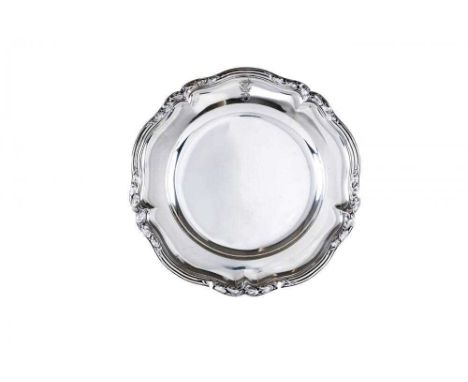 AN EARLY VICTORIAN SILVER PLATE, maker Paul Storr, London 1838, of lobed circular form, the reeded rim cast with trailing lea