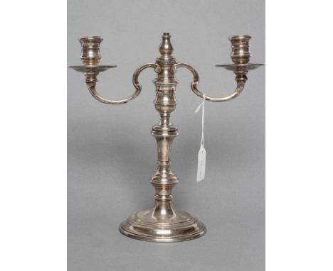 A SILVER TWO BRANCH CANDELABRUM, maker C.R. Culverwell, London 1975, in George I style, the bobbin sockets with fixed dished 