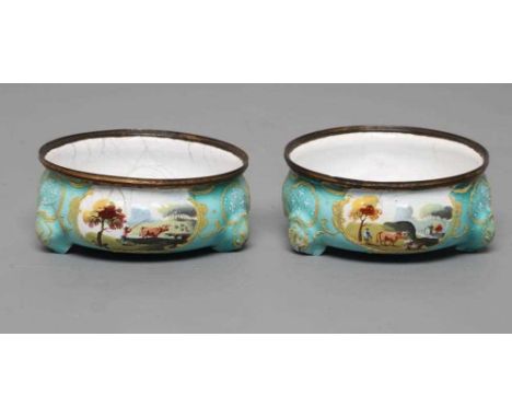 A PAIR OF ENGLISH ENAMEL CAULDRON SALTS, late 18th century, of bombe circular form, each painted with three bucolic landscape