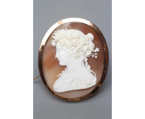 A VICTORIAN SHELL CAMEO of oval form, carved with the head and shoulders portrait of a young lady wearing a circlet of flower