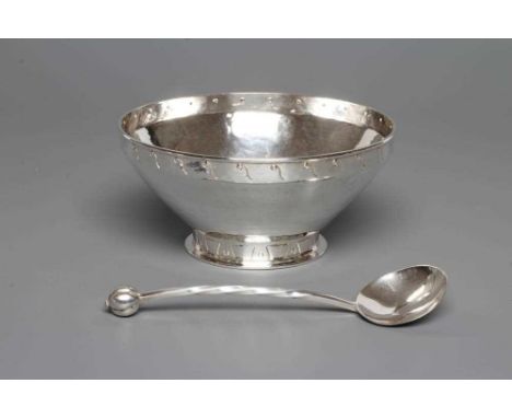 AN ARTS AND CRAFTS BOWL, maker A. E. Jones, Birmingham 1929, of shallow conical form, the straight rim spot hammered and engr