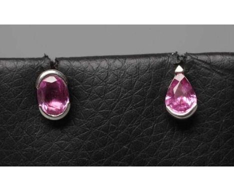 A PAIR OF CARTIER ASYMETRICAL PINK SAPPHIRE EARRINGS, possibly from the Meli Melo collection, one oval and one tear cut, in w