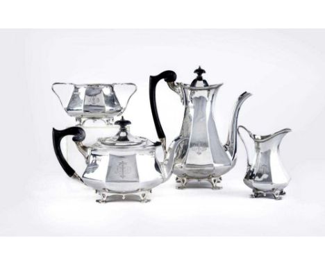 AN EDWARDIAN SILVER FOUR PIECE TEA AND COFFEE SERVICE, maker Ackroyd Rhodes, of swept octagonal form raised upon four stylise