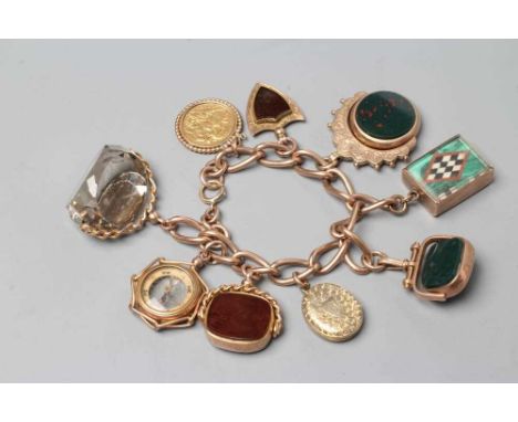 A 9CT GOLD CHARM BRACELET hung with a loose mounted 1912 sovereign, a double sided pietra dura oblong charm (Palio flags?), 9