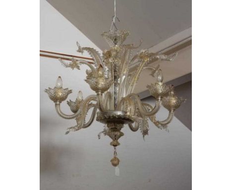 A VENETIAN SIX LIGHT CLEAR GLASS CHANDELIER, early 20th century, the baluster stem with upturned corona and issuing wrythen s