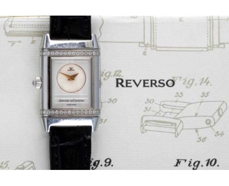 A LADY'S JAEGER-LECOULTRE DIAMOND REVERSO WRISTWATCH, one side with small mother of pearl circular dial with gilt metal backs