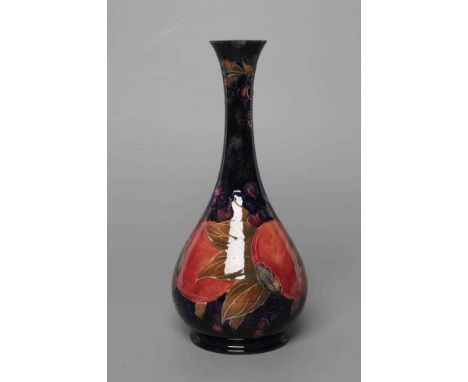 A MOORCROFT POTTERY POMEGRANATE BOTTLE VASE, early 20th century, tubelined and painted in typical palette, impressed Burslem 