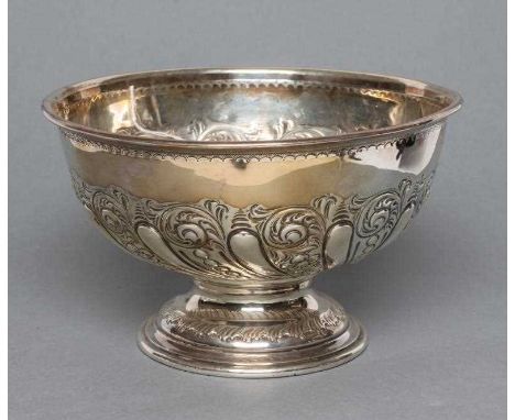 A LATE VICTORIAN SILVER ROSE BOWL, maker's mark J.D.&amp;S., Sheffield 1900, of semi-wrythen fluted form chased with scrolls,