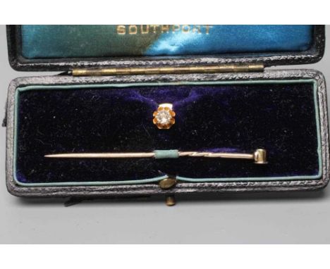 A VICTORIAN DIAMOND STICK PIN/STUD, the old brilliant cut stone of approximately 0.12cts claw set to a plain stud stamped 18,