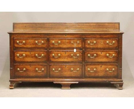 A GEORGIAN OAK AND MAHOGANY BANDED LANCASHIRE DRESSER, second half 18th century, the top with ledge back and moulded edged hi