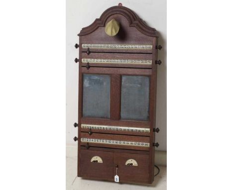 AN OAK BILLIARD ROOM SCORE BOARD, c.1900, of oblong form with moulded cornice over an early electric light fitting, two slate