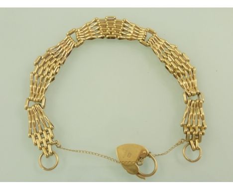 A 9CT GOLD FANCY FIVE-BAR TAPERED GATE BRACELET with padlock clasp, 13g. 